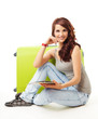 Foto: Nice smiling girl with her luggage Nice smiling girl with her luggage