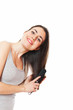 Beautiful young female combing her hair
