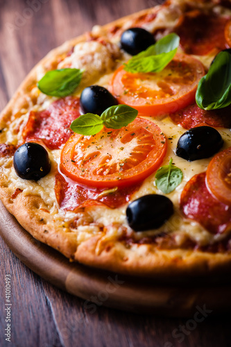 Photo: Pizza with Salami, Tomatoes and Olives Pizza with Salami, Tomatoes and Olives
