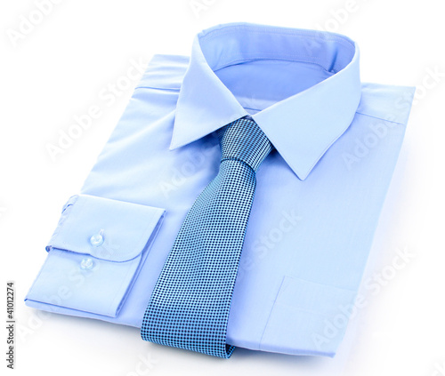 Photo: New blue man's shirt and tie isolated on white New blue man's shirt and tie isolated on white