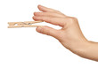 clothes pin in hand, isolated on white background clothes pin in hand, isolated on white background