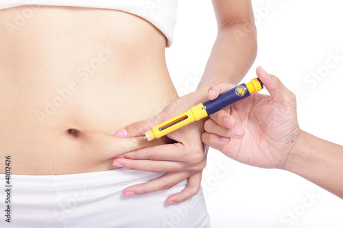 Photo: close up of woman inject drugs to prepare for treatment close up of woman inject drugs to prepare for treatment