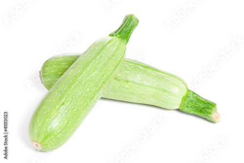 Photo: Green fresh Zucchini isolated on white background Green fresh Zucchini isolated on white background