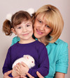 mother and daughter with dwarf white bunny mother and daughter with dwarf white bunny