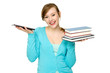 Foto: Female student with books and digital tablet Female student with books and digital tablet