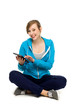 Foto: Female teenager using digital tablet Female teenager using digital tablet