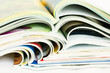 heap of open magazines