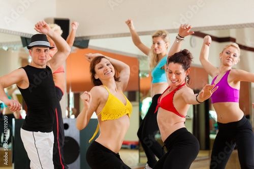 Photo: Zumba or Jazzdance - young people dancing in studio Zumba or Jazzdance - young people dancing in studio