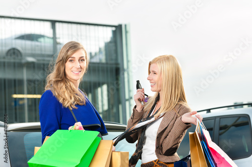 Photo: Two women were shopping and driving home Two women were shopping and driving home