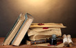 old books, scrolls, ink pen and inkwell old books, scrolls, ink pen and inkwell