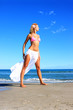 Young fashion woman on the beach