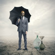 Photo: Global Warming:Businessman waiting for the rain Global Warming:Businessman waiting for the rain