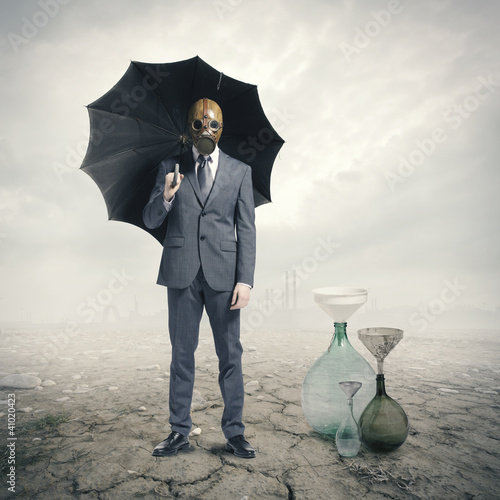 Photo: Global Warming:Businessman waiting for the rain Global Warming:Businessman waiting for the rain