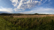 view of Czech countryside, of farms and a hill with a church view of Czech countryside, of farms and a hill with a church