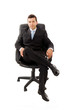 Young business man sitting in a chair and relaxing, isolated on Young business man sitting in a chair and relaxing, isolated on