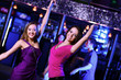 Photo: Young woman having fun at nightclub disco Young woman having fun at nightclub disco