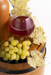 Glass and bottle of red wine with green leaf Glass and bottle of red wine with green leaf
