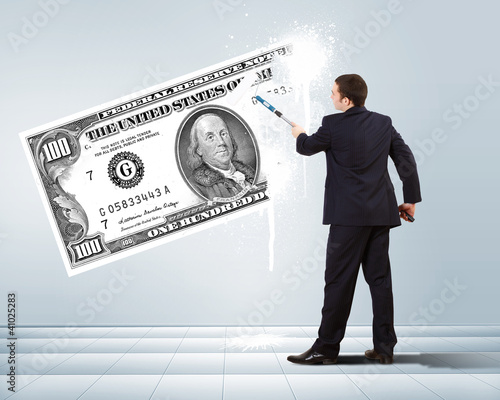 Photo: Businessman with a paint brush and banknote Businessman with a paint brush and banknote