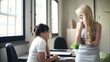 Video: Two happy young businesswomen chatting in the office Two happy young businesswomen chatting in the office