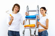 Young couple with paint brushes together