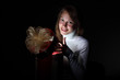 Young woman reading a magic book