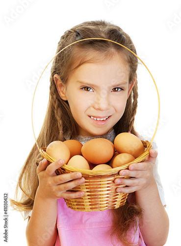 Photo: little girl holding basket of raw eggs little girl holding basket of raw eggs
