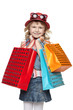 Little girl with shopping bags over white