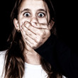 Scared girl being abused by an adult man