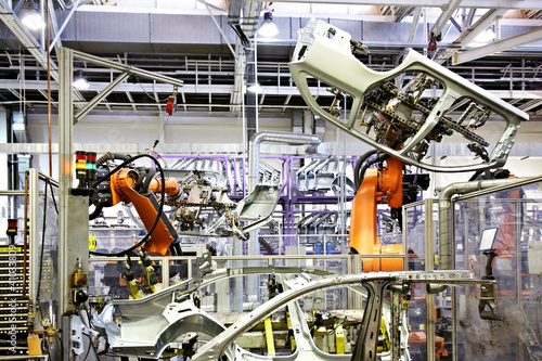Photo: robots in a car factory robots in a car factory