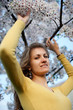 Young woman with spring flowers of sakura Young woman with spring flowers of sakura