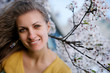 Young woman with spring flowers of sakura Young woman with spring flowers of sakura