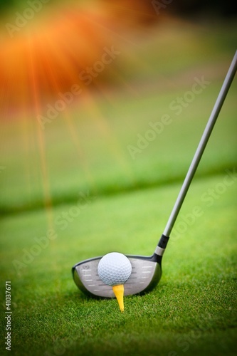 Photo: Macro shot of a golf club ready to drive the ball Macro shot of a golf club ready to drive the ball