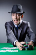 Casino player playing with chips