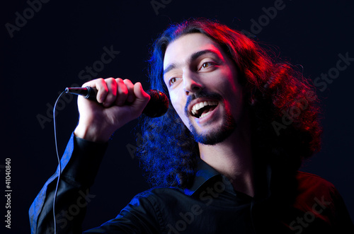 Photo: Man singing at the concert Man singing at the concert