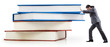 Businessman with books on white