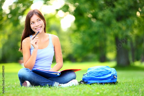 Photo: Student thinking looking in park Student thinking looking in park