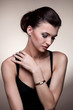 Portrait of luxury woman in exclusive jewelry watch