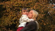 Daughter and mother together at autumn late evening