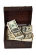 US dollars banknotes in treasure chest. Isolated on white US dollars banknotes in treasure chest. Isolated on white