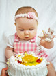 Little girl with a sweet cake