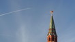 Jet airplane over Moscow Kremlin tower