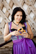 German girl wearing typical bavarian clothes holding breze