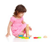 Funny little child playing with colorful toys, isolated over whi Funny little child playing with colorful toys, isolated over whi