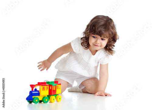 Photo: child playing with colourful toy. Isolated on white background child playing with colourful toy. Isolated on white background