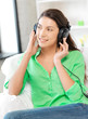 happy teenage girl in big headphones