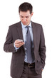 Portrait of a young caucasian business man using a mobile phone