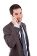 Portrait of a young caucasian business man using a mobile phone