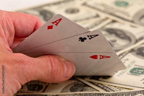 Фото: people show three ace on a money background people show three ace on a money background