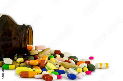 Photo: Drugs from the bottle (isolated) Drugs from the bottle (isolated)