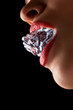 Ice cube in woman's mouth.